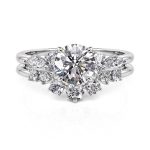 Jeulia Conjunto de Anillos para Novia Clásico Corte Redondo con Piedra Lateral de Plata de Ley